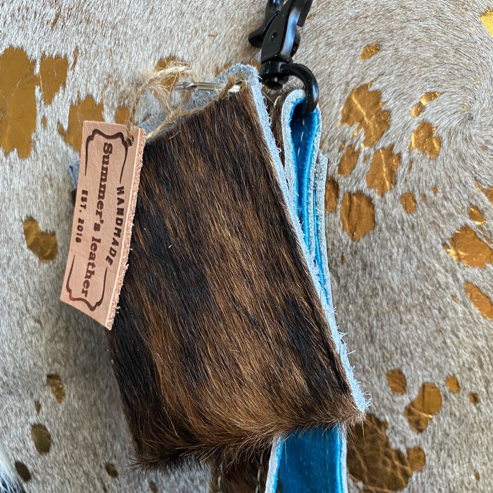 Leather hair on hide western lanyard and card holder.